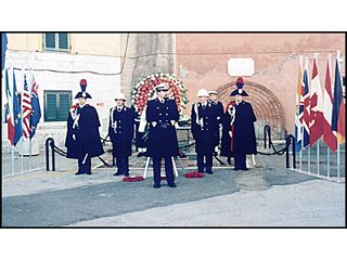 The beginning of the wreath laying ceremony beneath the Spartan memorial plaque.