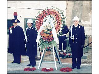 Preparing to carry the wreaths to the cemetery.