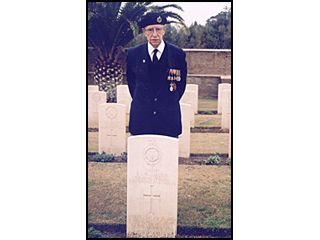 Bob Odell at the grave of Captain P. S. H. Osborn, Royal Fusiliers.